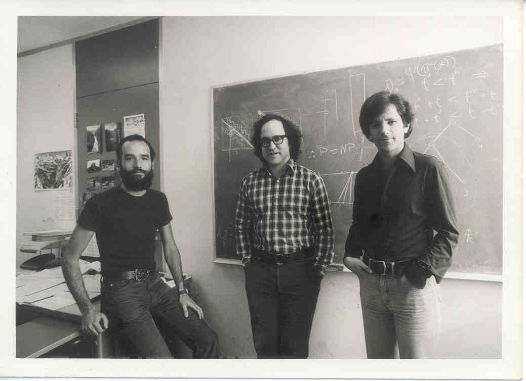 Adi,Ron,Len in front of blackboard