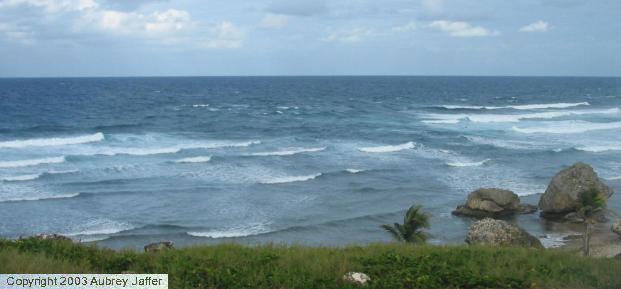 rocks undercut by ocean surf