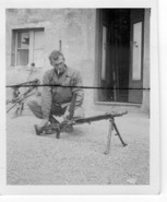 Lt Thomas w captured German MG.jpg