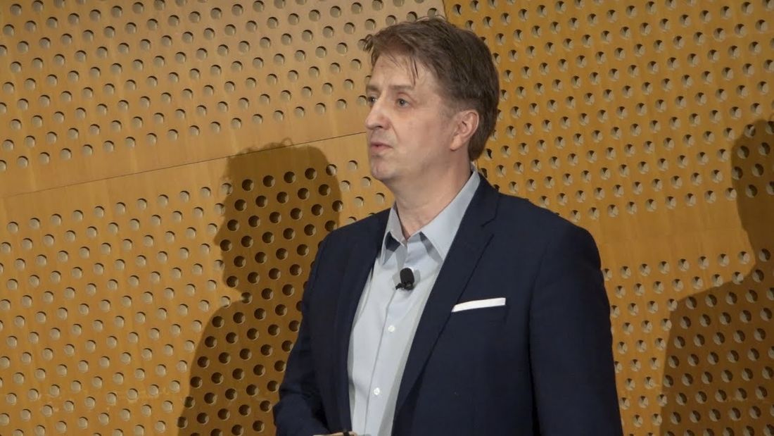 Wojciech Matusik speaking on stage at TEDxMIT